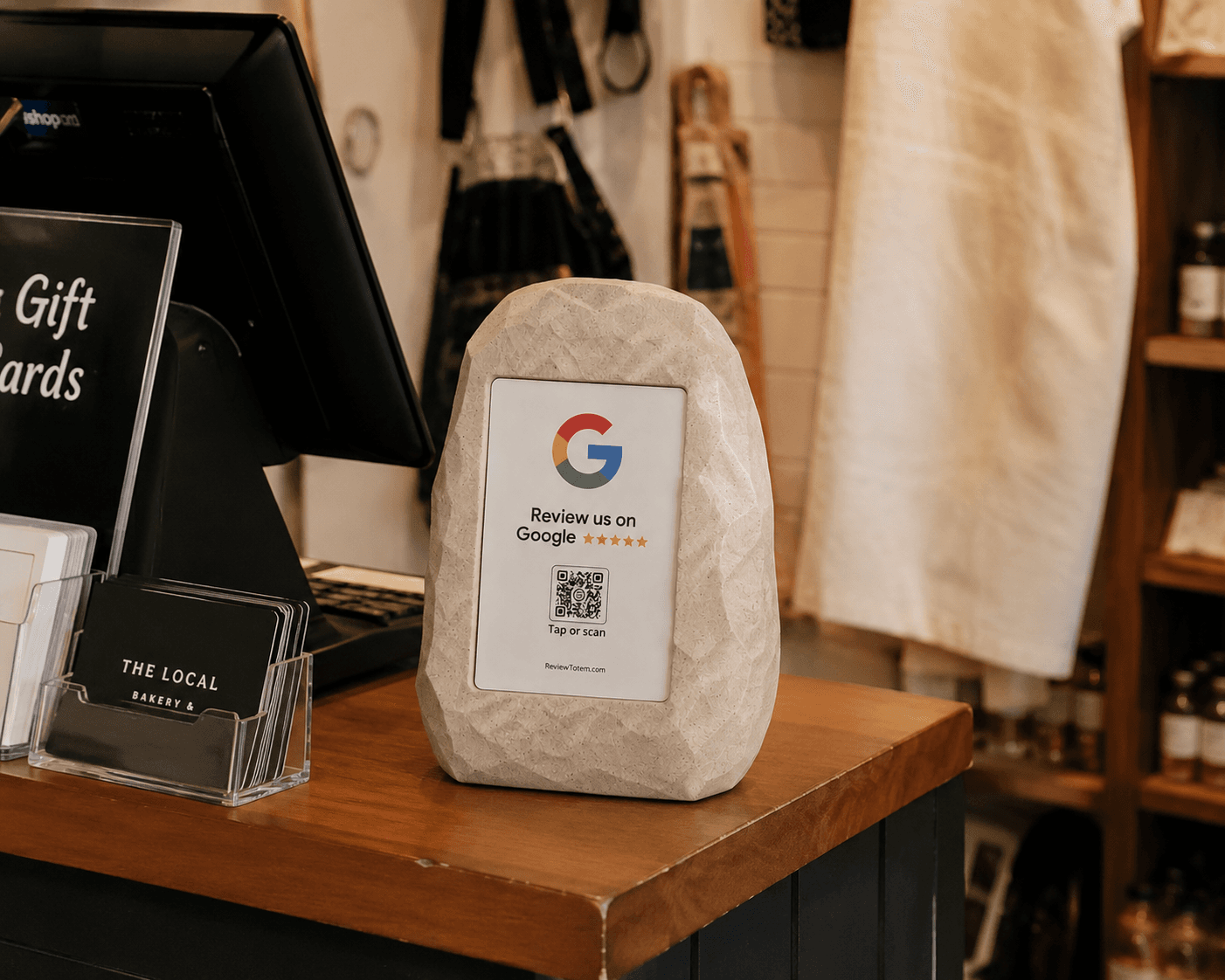Review Totem on a boutique shop counter